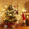 Christmas tree decorated with gold and white star and moon LED string lights in a cozy room setting