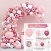 A large arch of pink and white latex balloons with various sizes and glitter accents for celebrations