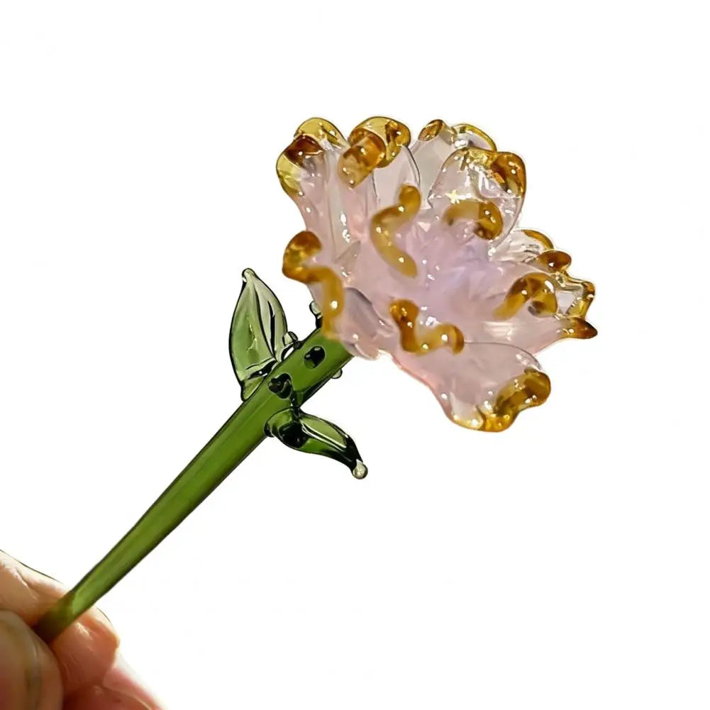 Handcrafted blue glass flower sculpture with translucent pink petals and gold accents