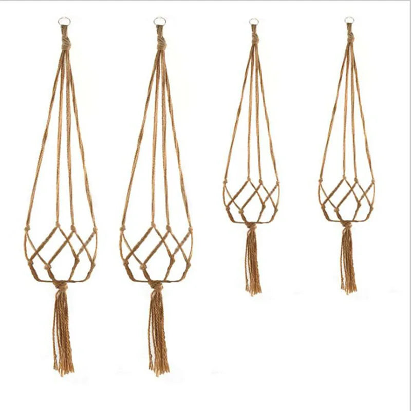 Four handmade macrame plant hangers made of natural brown cotton rope with tassels.
