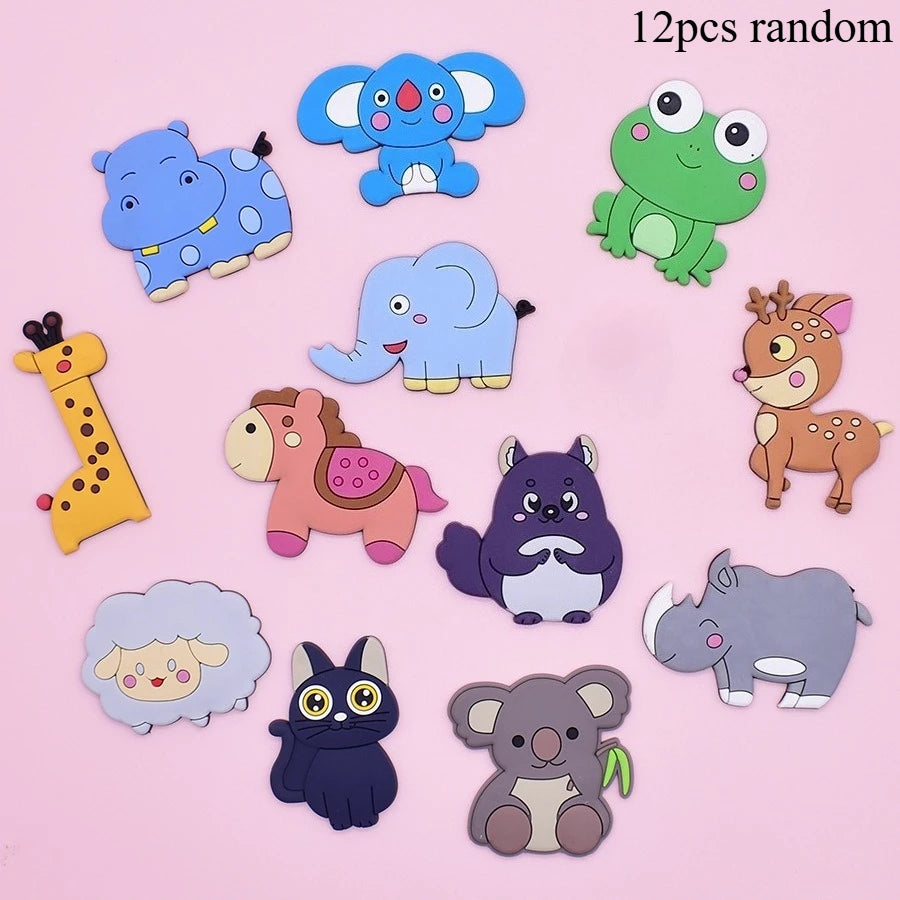 A collection of twelve random soft pastel animal fridge magnets including elephants, dinosaurs, and other cute creatures.