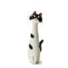 A white and black cat-shaped resin vase for dried flowers.