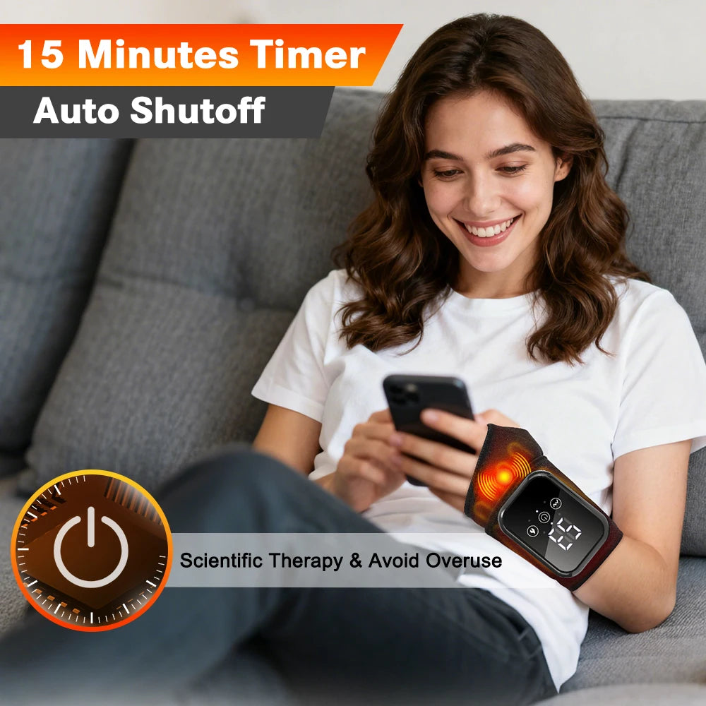 A woman is using a rechargeable heated wrist massager with vibration therapy on her hand while relaxing on a couch.