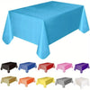 A collection of disposable solid color tablecloths in various shades including blue, red, pink, purple, and yellow.