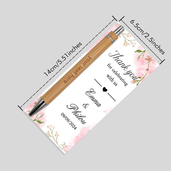 A wooden pen with a card featuring pink floral designs and personalized text is shown.