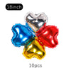 A set of ten heart-shaped foil balloons in silver, blue, red, and gold colors for party decoration.