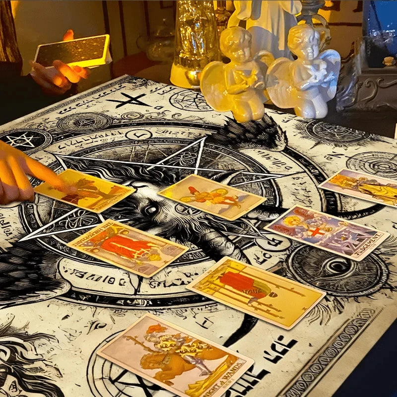 A close-up of an occult pentagram tablecloth with Hebrew runes and several tarot cards laid out on the surface.