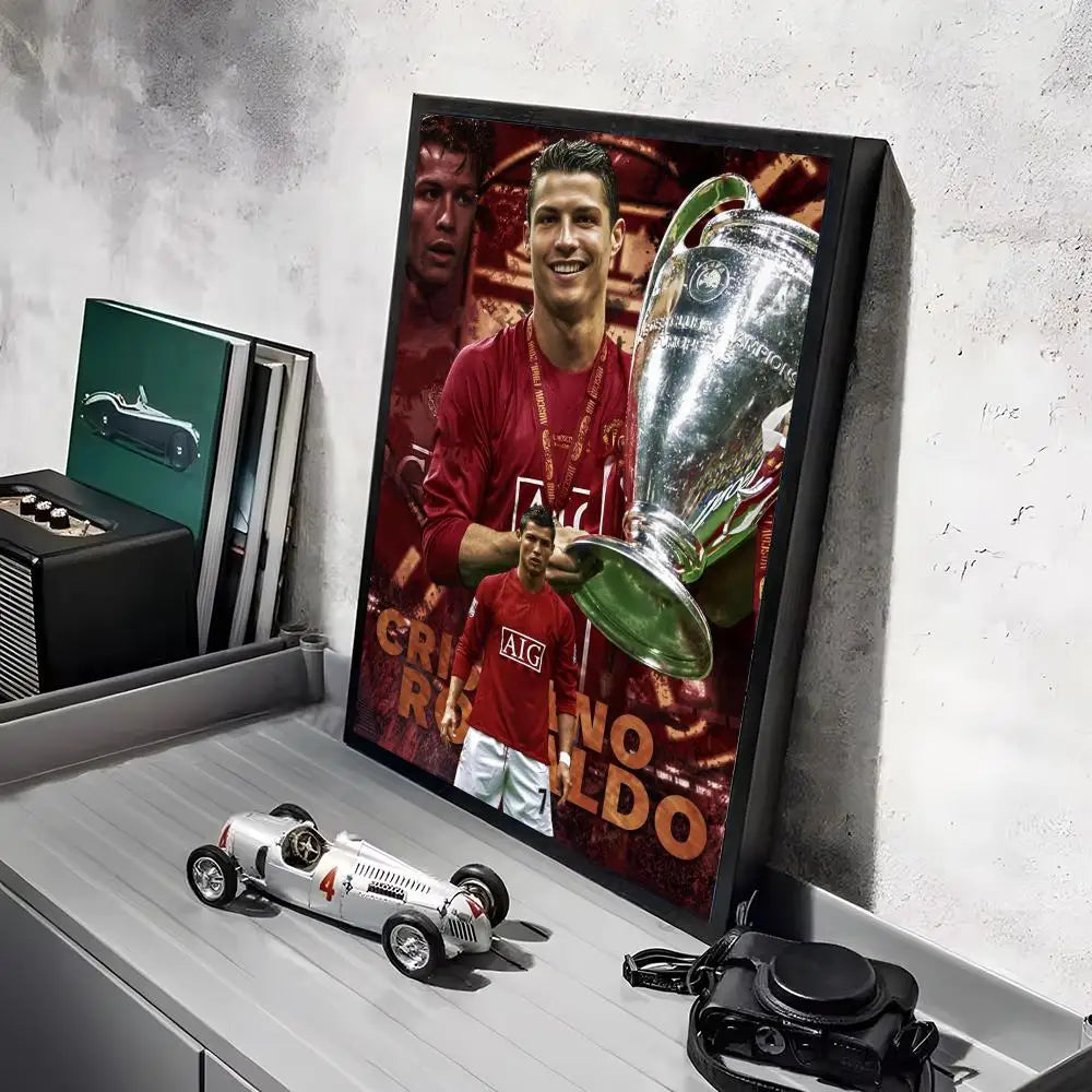 A framed canvas art poster featuring a portrait of Ronaldo in a red shirt and a silver trophy.