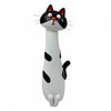 A white and black resin cat flower vase with large eyes and whiskers.