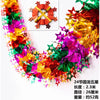 A colorful tinsel garland ribbon featuring red, green, purple, and gold shreds for holiday decoration.