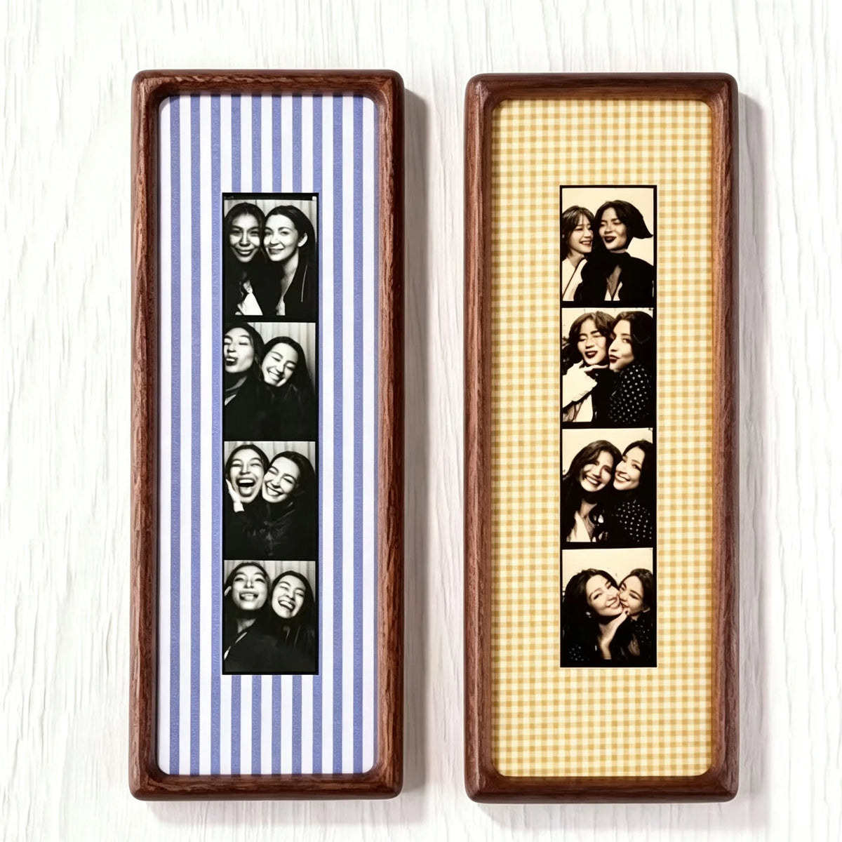Two wooden photo strip frames with black and white portraits inside