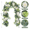 Artificial eucalyptus and rose garland featuring white flowers, green leaves, and white berries.