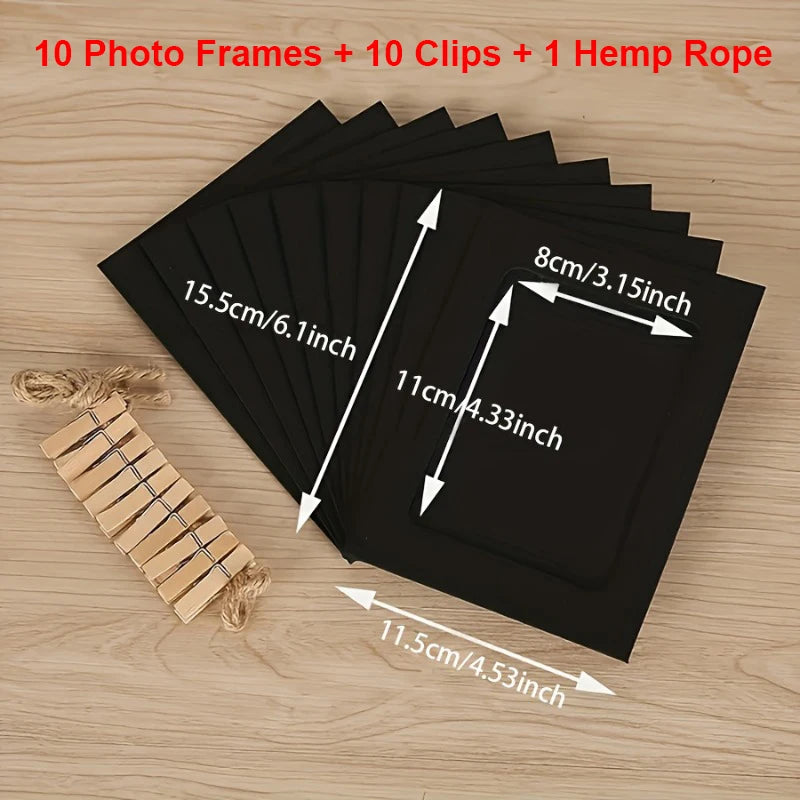 A set of ten black photo frames, ten clips, and one hemp rope displayed on a wooden surface.