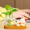 Mini resin desk ornament featuring a glass vase with green ivy and a small white lucky cat figurine