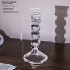 Elegant clear glass pillar candle holder with a wide base and stacked bulbous sections.