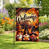 A Halloween garden flag featuring a welcome sign with bats, fireworks, and witch hats.