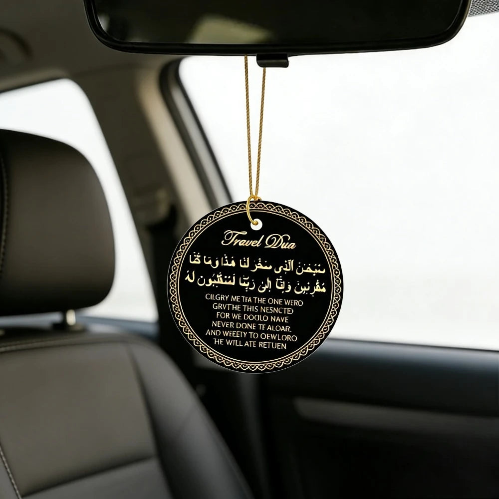 A round leather tag with gold thread hanging from a rearview mirror, featuring Arabic and English text.
