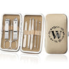 An open leather case displaying an 8-piece stainless steel manicure and pedicure kit with various tools.
