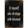 A dark, distressed metal tin sign with white text that reads I myself am strange and unusual.