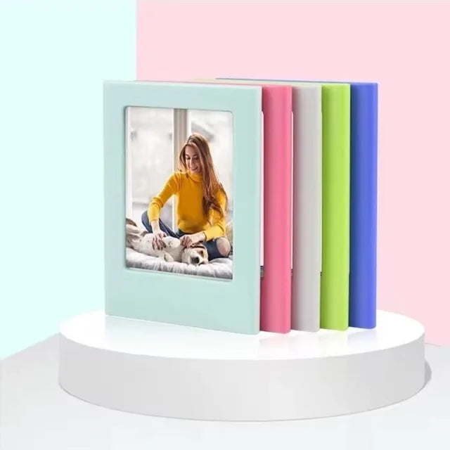 A set of five magnetic photo frames in pastel colors, including pink, mint green, and purple, displayed on a white stand.