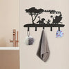 Black silhouette decorative metal key hooks for wall organization featuring a tree and a monkey