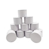 A set of white metal candle tins with lids arranged in a pyramid formation.