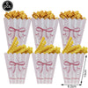 A set of six pink paper cups filled with yellow potato chips and decorated with bows for a birthday party.