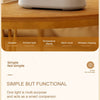 A modern, silver wireless charging speaker lamp with a display and various functions shown on a wooden surface.