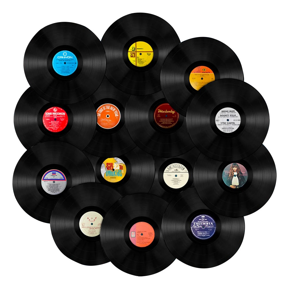 A collection of black vinyl records displayed on a white background.