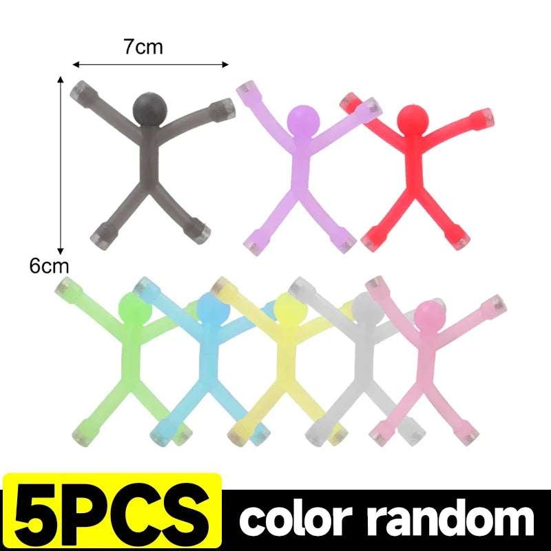 Five colorful flexible mini figures used as refrigerator magnets