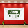 A white banner featuring the green Jeep logo displayed on a red wall.