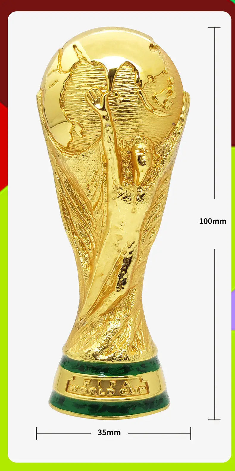 Gold trophy figurine of the FIFA World Cup, featuring a green base.