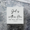 A white card with black script text reads God is within Her She will not fall Psalm 46:5 set against a textured gray backgrou