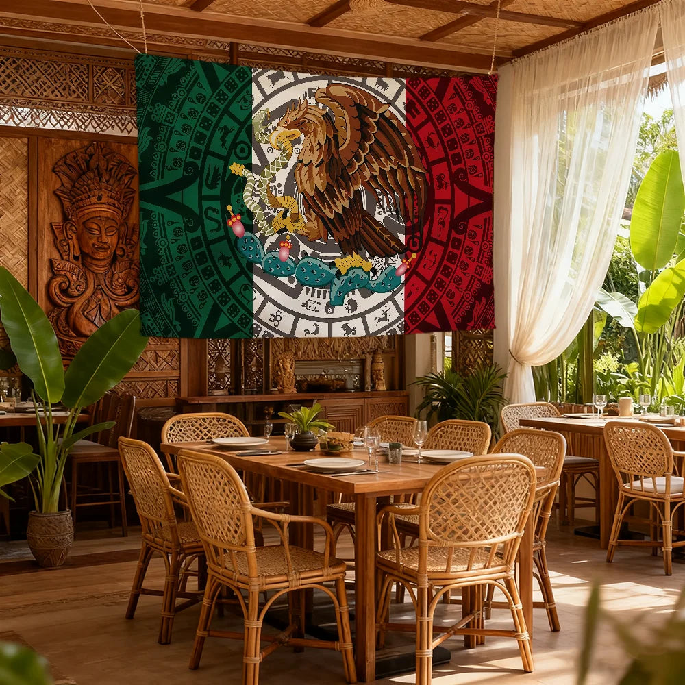 A decorative banner featuring the Mexican flag design with a golden eagle and intricate patterns hanging indoors.