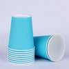 A stack of light blue disposable cups with white rims and a single cup lying beside them.