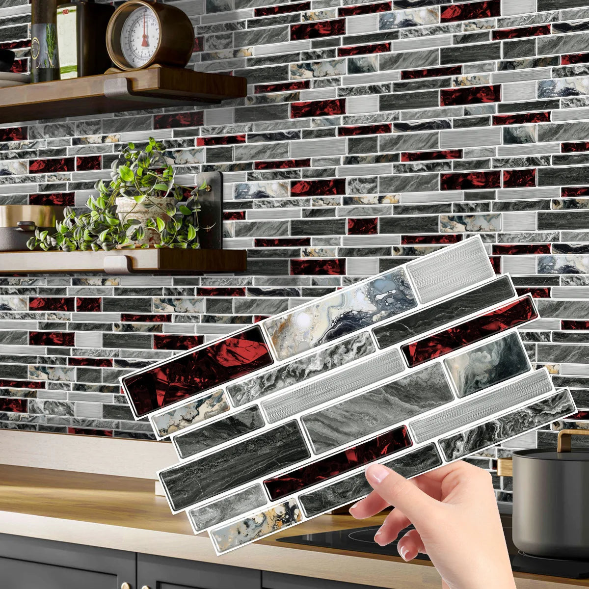 A hand holds a piece of crystal film marble wall decal against a dark gray and red marble tile background.