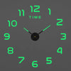 A digital clock face showing 12 o'clock with green hour markers and a black hand.