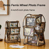A set of vintage resin rotating photo frames in gold-toned metal, displayed on a wooden surface.