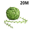 A spherical bundle of artificial green climbing vine branches.