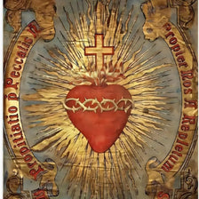Vintage metal sign depicting the Sacred Heart of Jesus with rays of light and surrounding text.