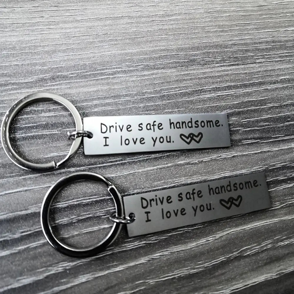 Silver engraved stainless steel keychain with the message Drive safe handsome I love you