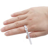 A hand holds an adjustable ring sizer with a built-in magnifier, showing the scale markings.