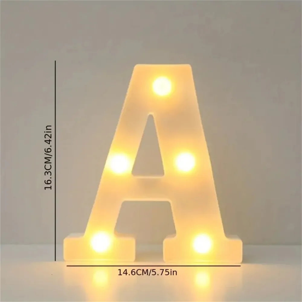 A shaped LED letter light in warm yellow glow used for room or party decor