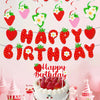 A strawberry birthday party decoration set featuring a banner, cake toppers, and a strawberry cake.