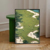A framed canvas print depicting golfers playing on a green golf course under natural light.