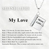 Silver pendant necklace featuring an openable book design with German text engraved on the cover