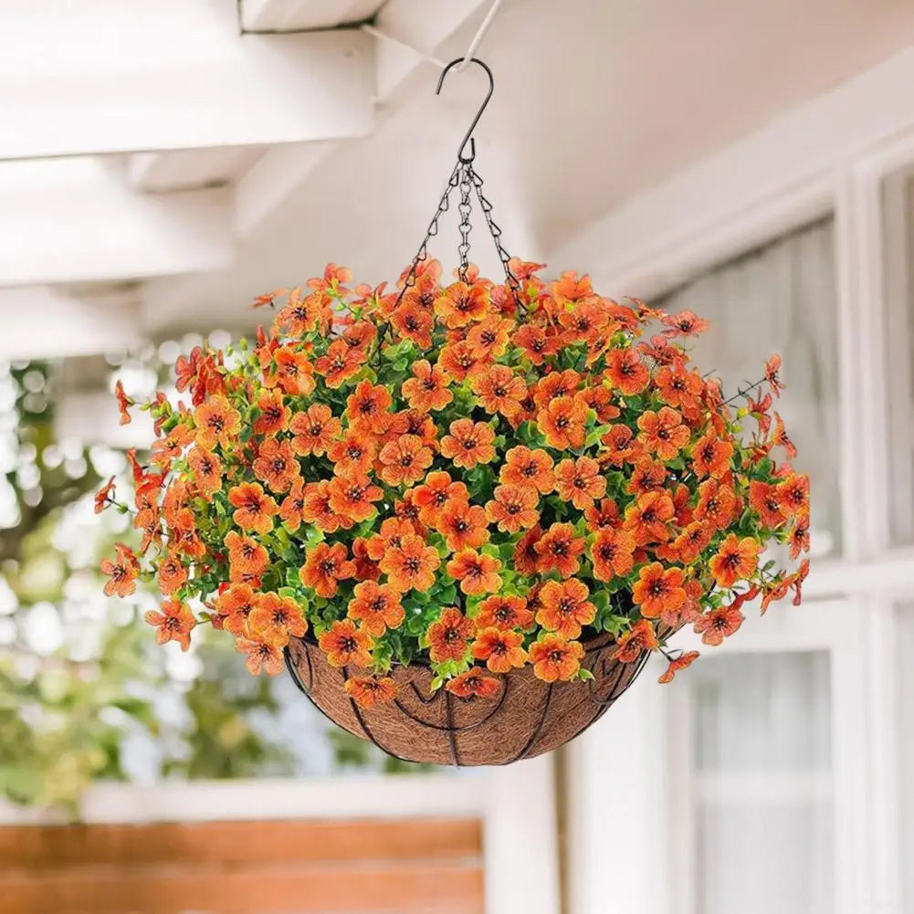 A realistic artificial flower hanging basket filled with vibrant orange and yellow blooms, suspended from the ceiling.