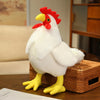 A white plush rooster stuffed animal toy with a red comb and yellow legs sitting on a woven box.
