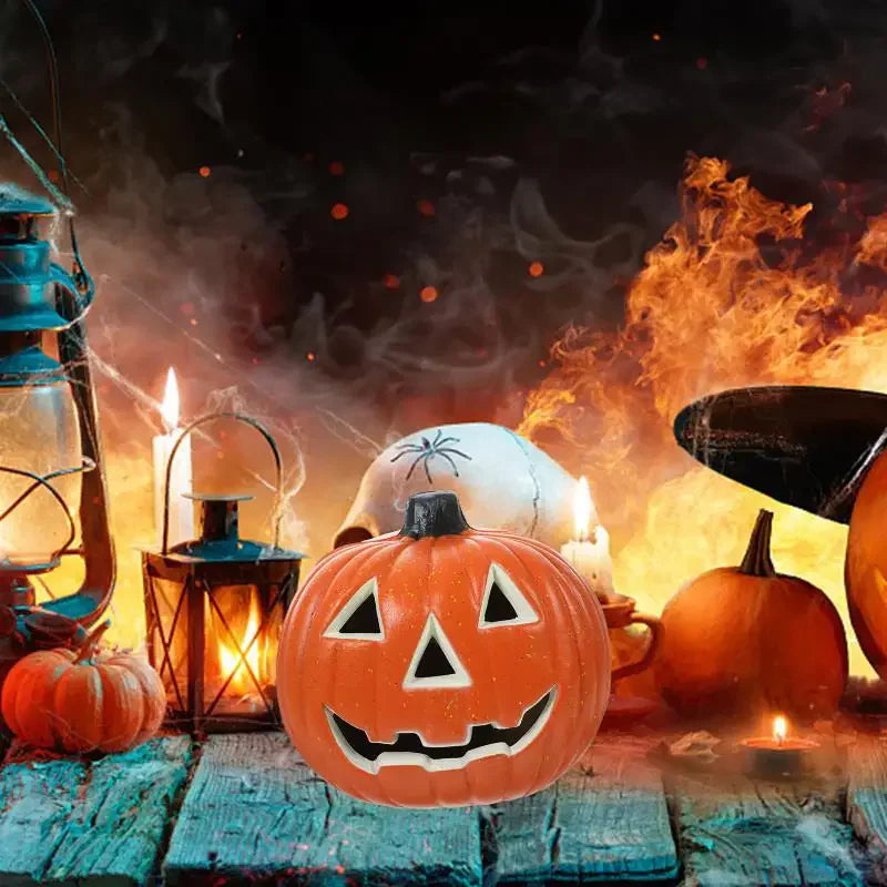 An orange carved jack-o'-lantern sits on a wooden surface surrounded by glowing candles and spooky atmospheric smoke.