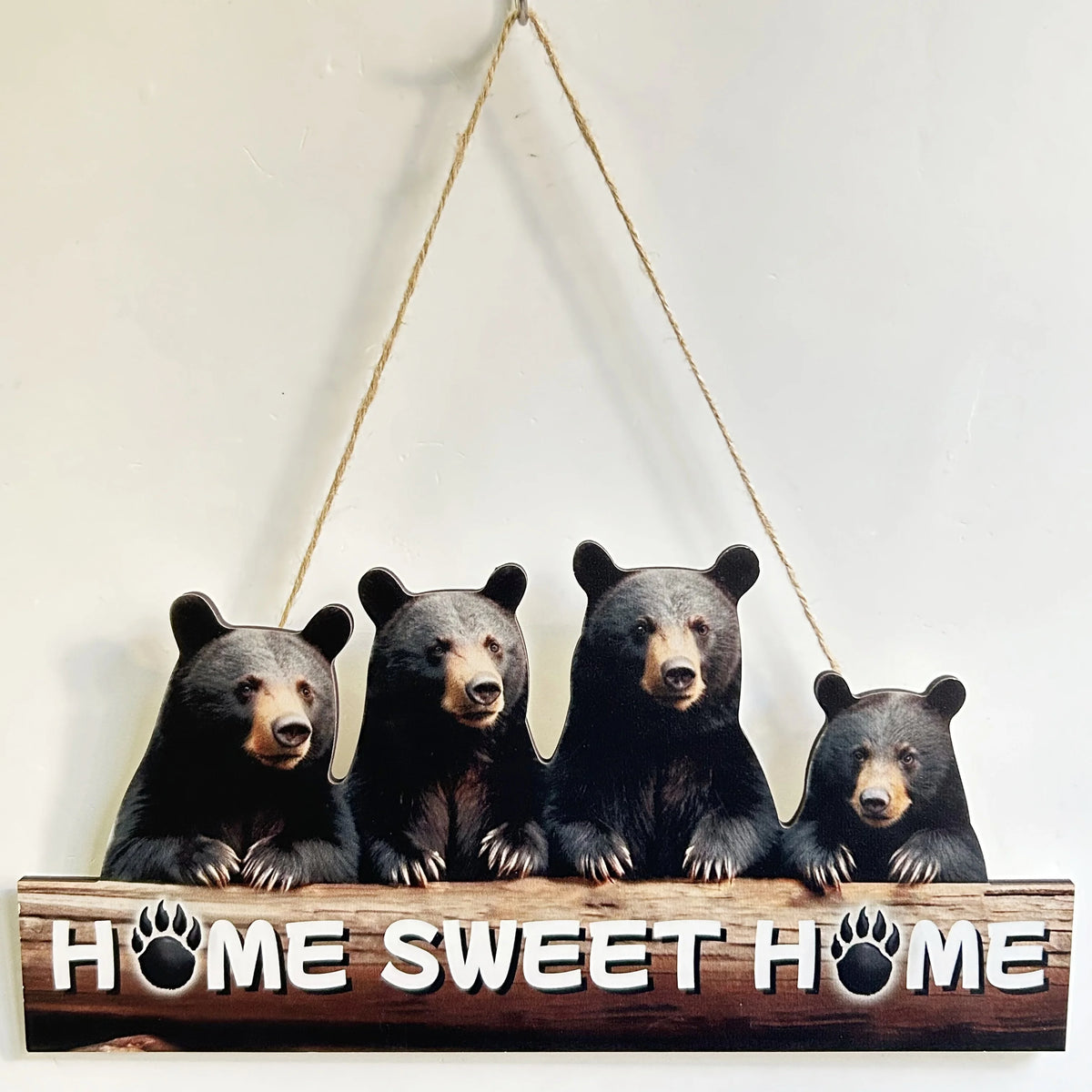 A wooden sign featuring four adorable black bears with paw prints, used as a rustic inspirational hanging sign.